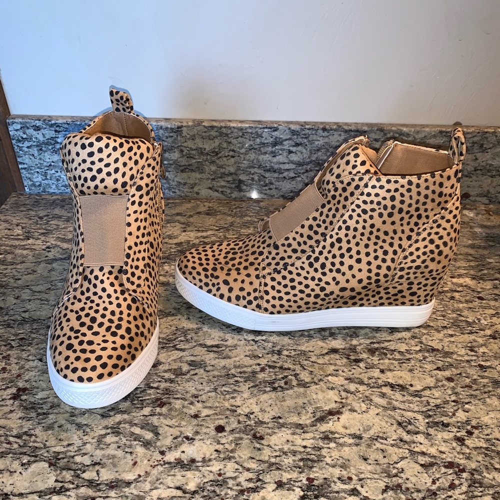 Leopard print wedged sneakers.